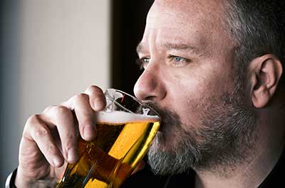 man drinking beer