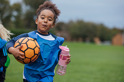 girl playing soccer