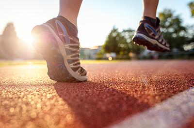 person running on track