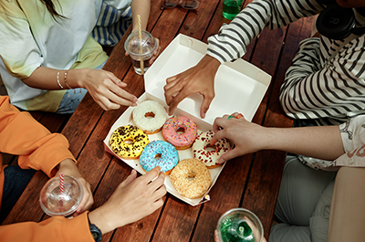 people eating donuts