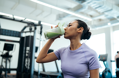 woman drinking workout shake