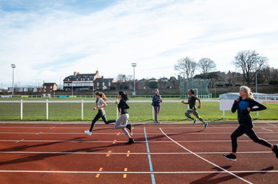 people running on track