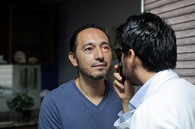 man getting vision checked