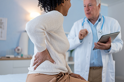 patient talking to doctor about back pain