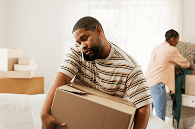 man moving boxes
