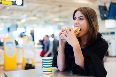 woman eating sandwich