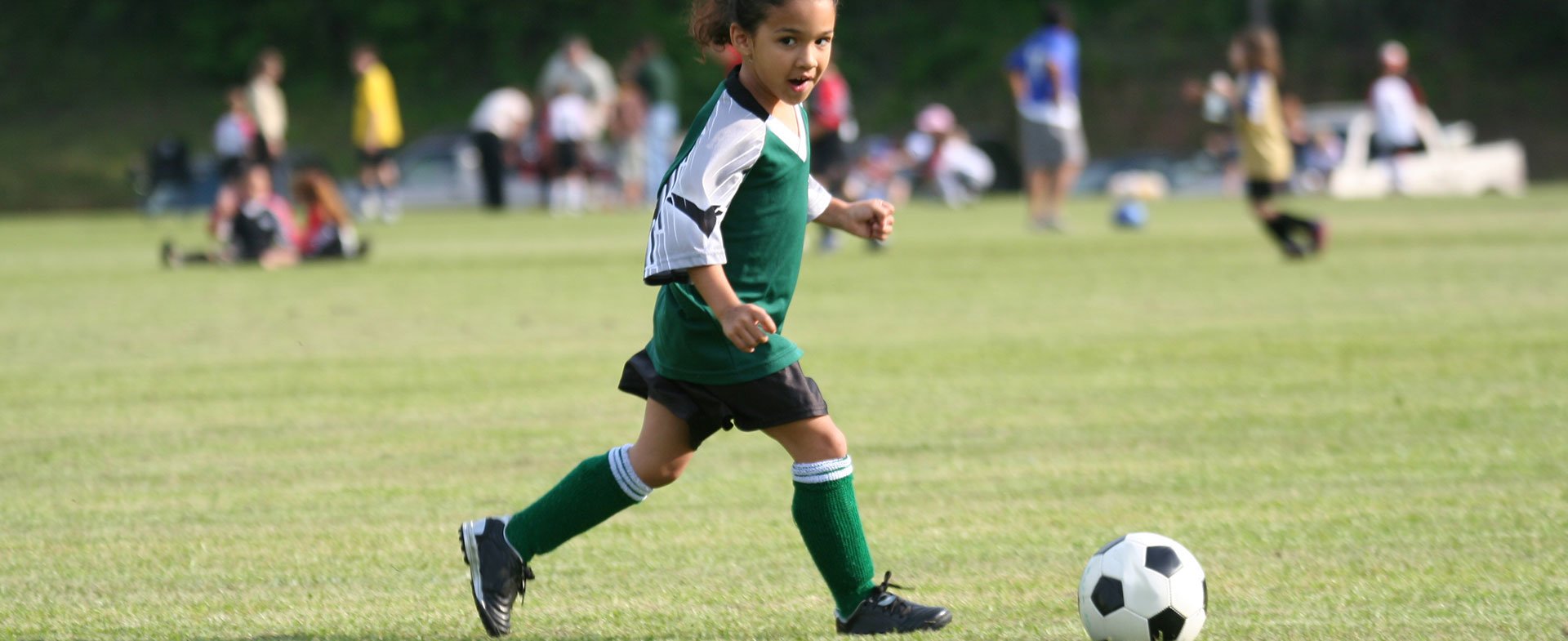 little girl playing soccer