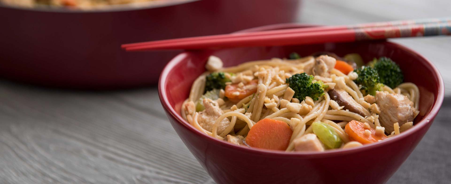chicken and peanut lo mein horizontal with pan