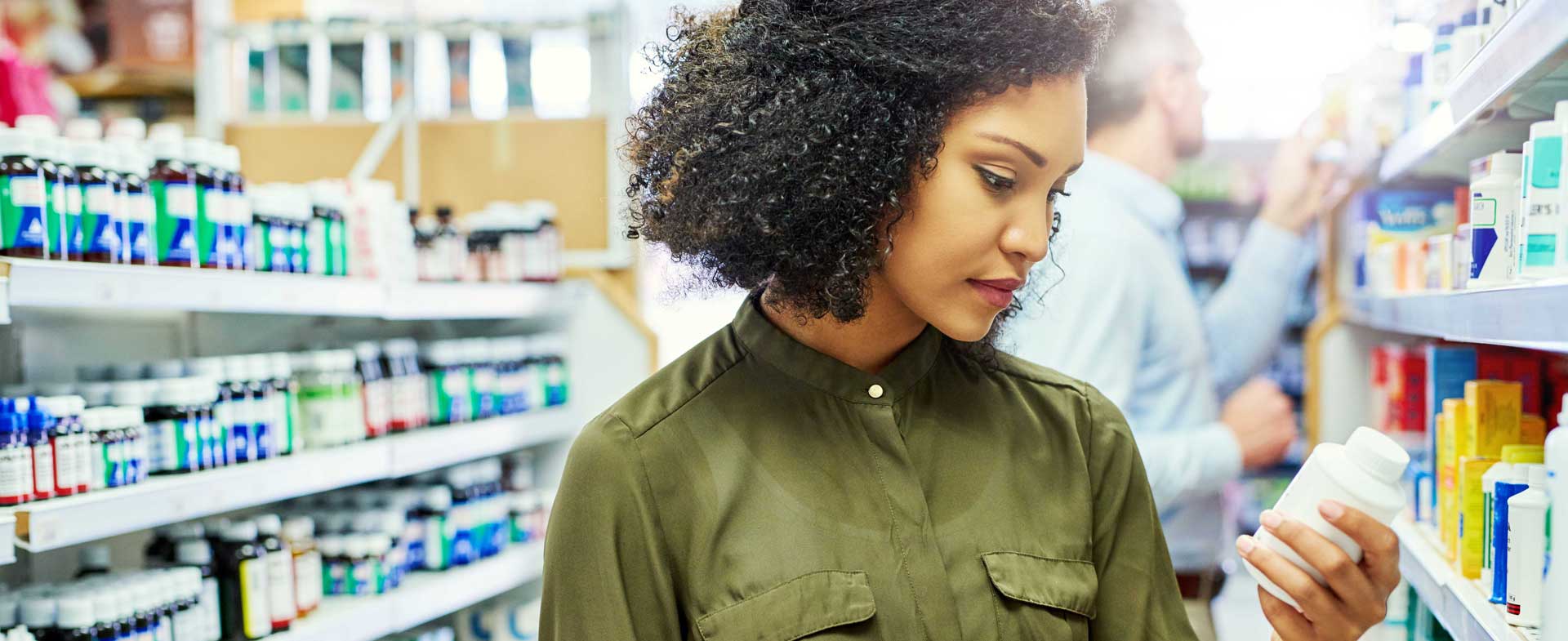 woman looking at vitamins