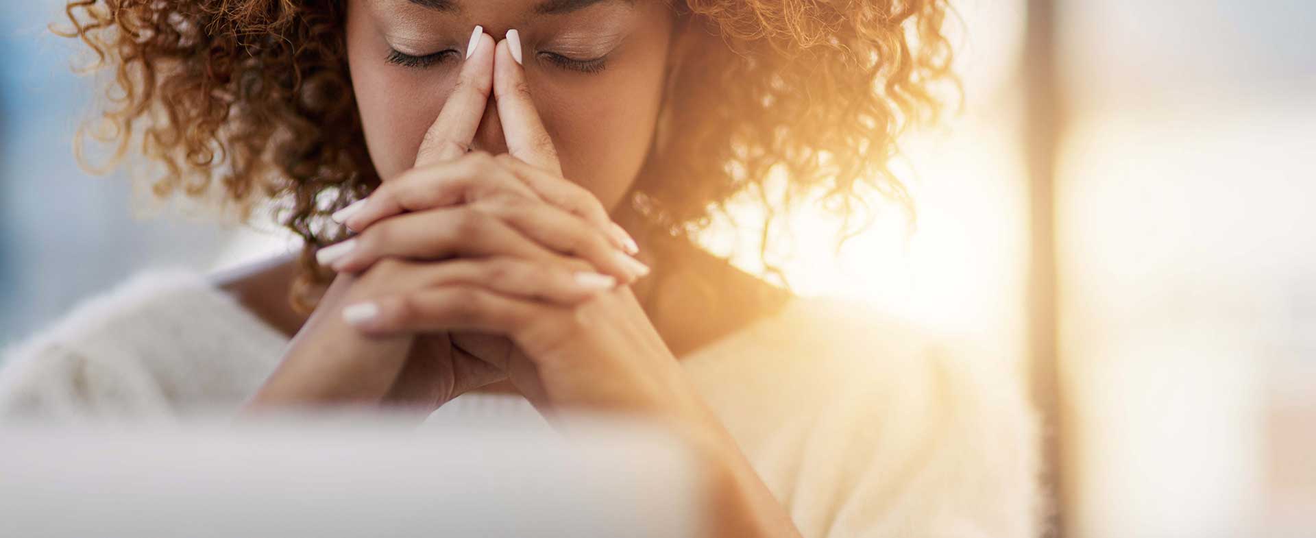 Worried woman researching cancer stages and survival rates on computer
