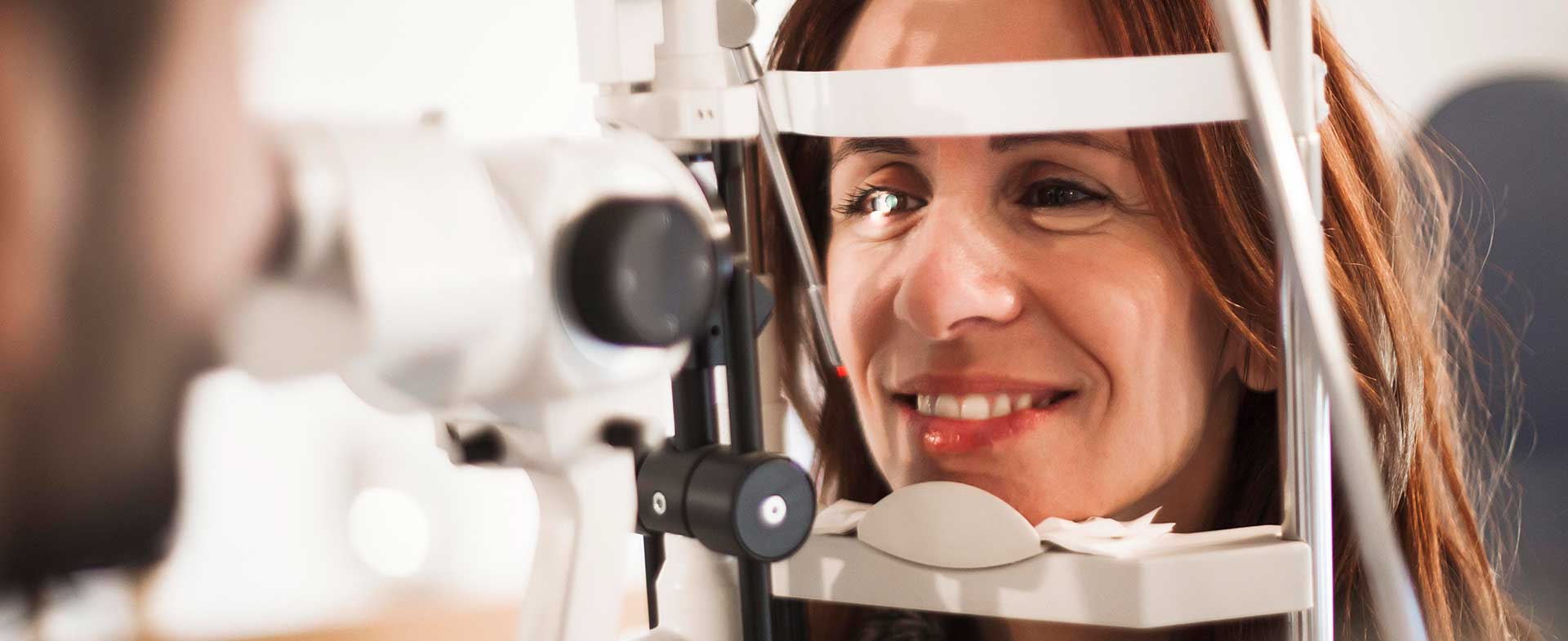 Woman over age 40 getting an eye exam 