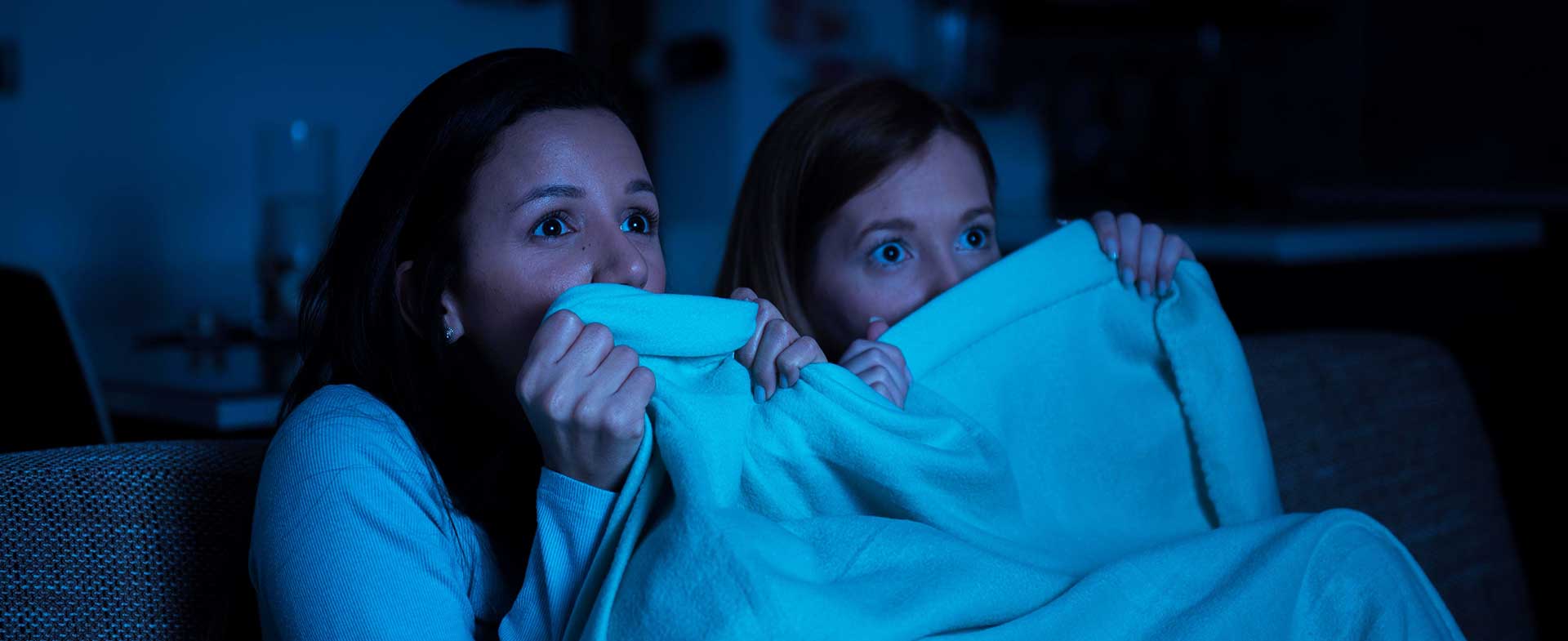 two women watching scary movie