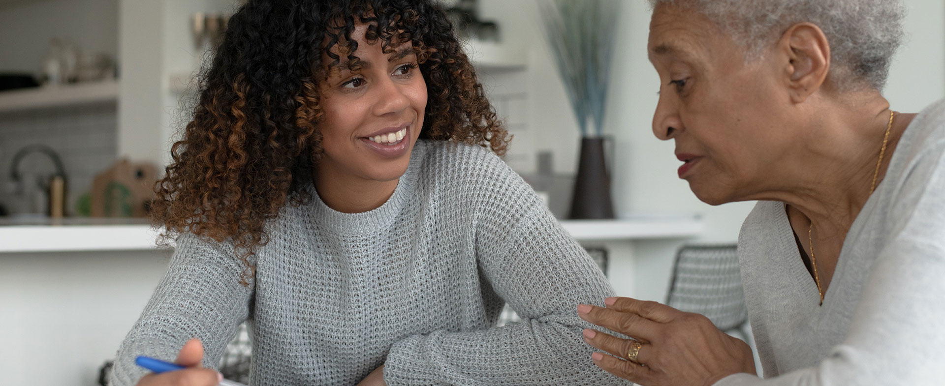 young woman talking with grandmother
