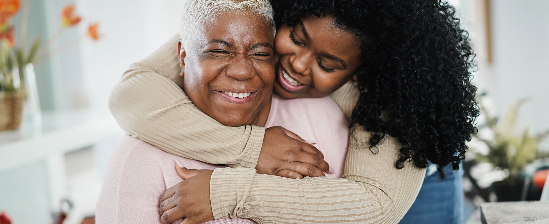 granddaughter embracing grandmother