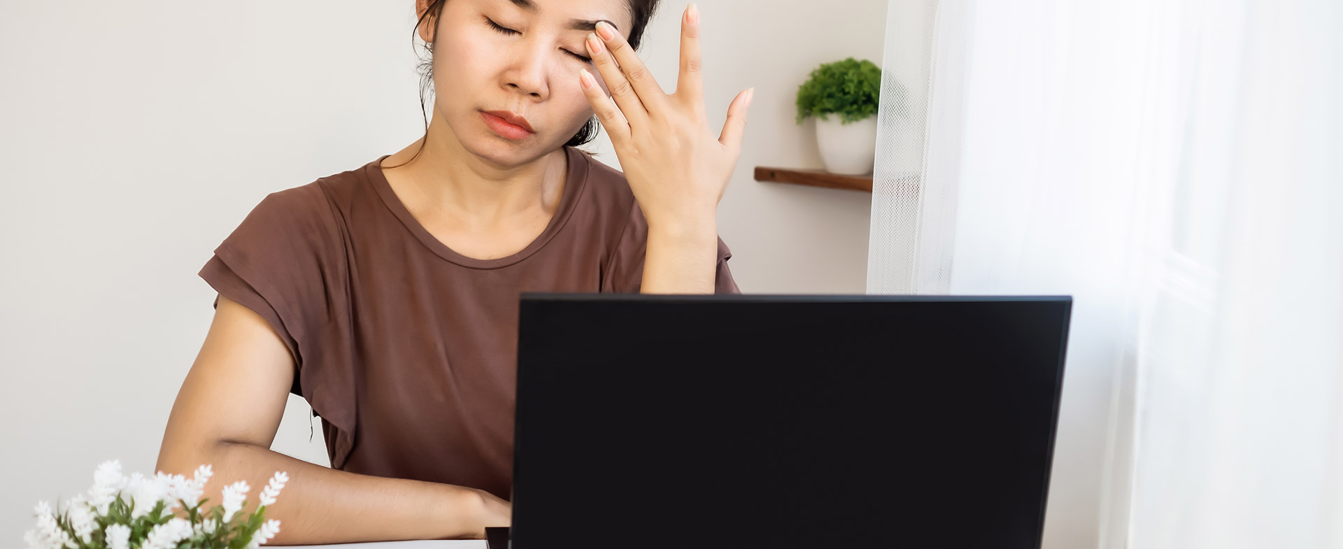 woman tired at her desk