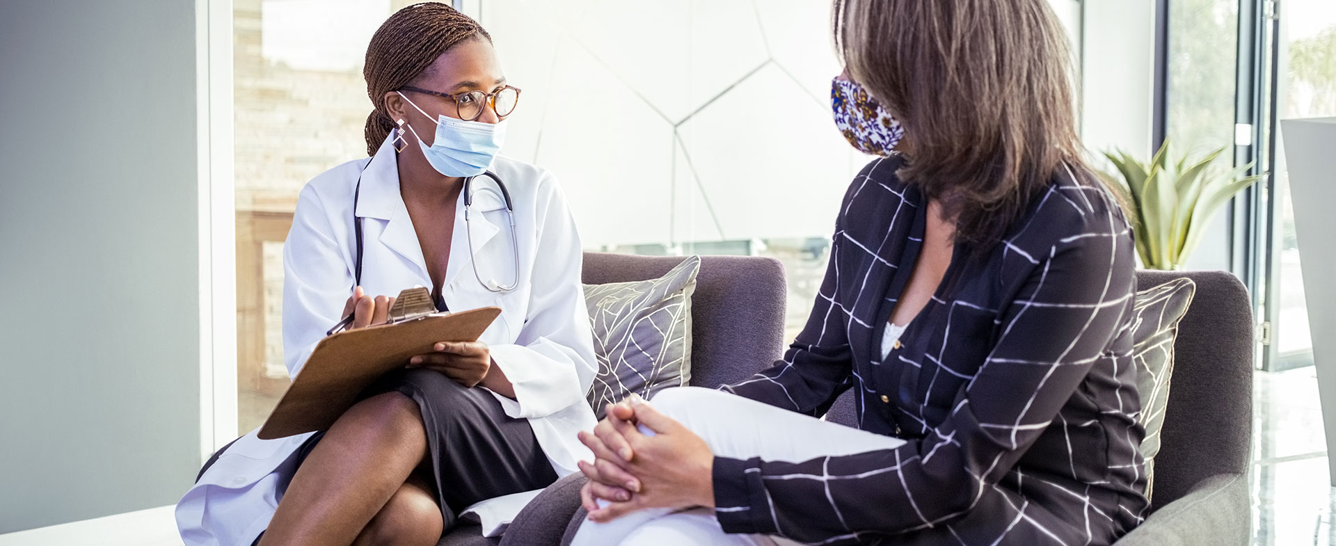 woman talking to doctor