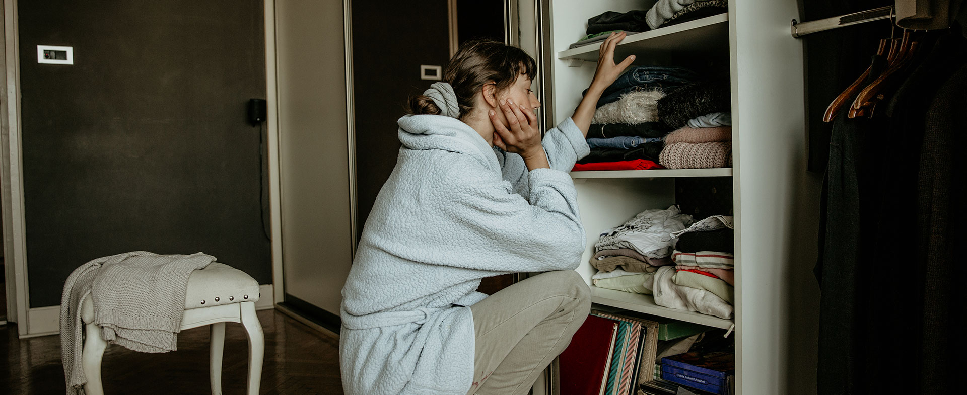 woman getting dressed in morning