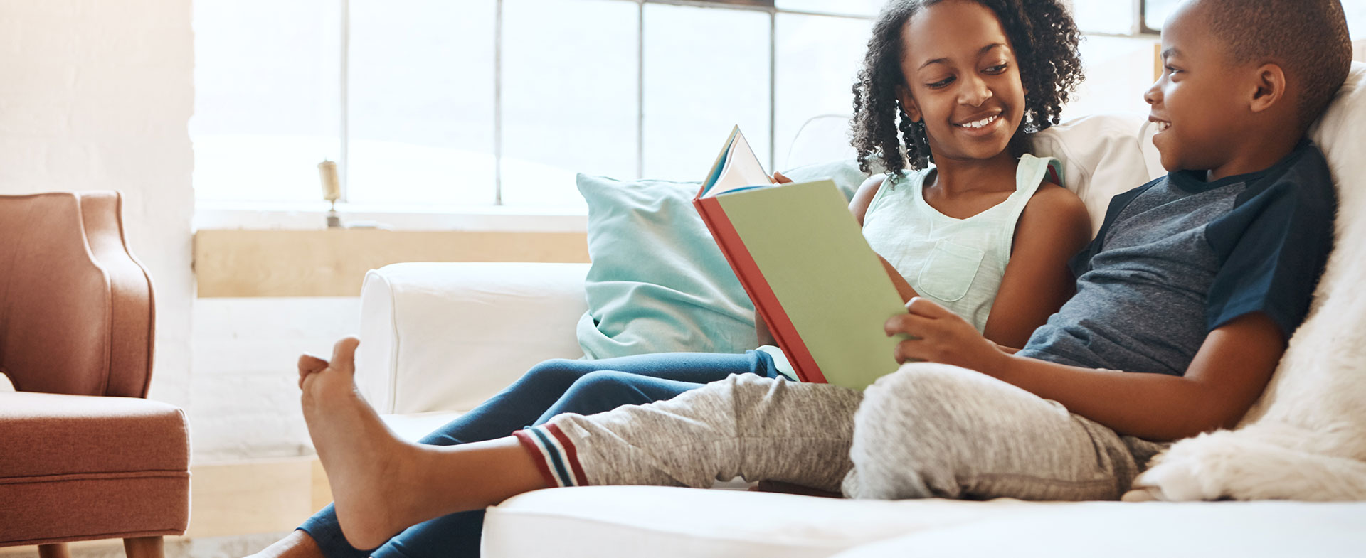 siblings reading together