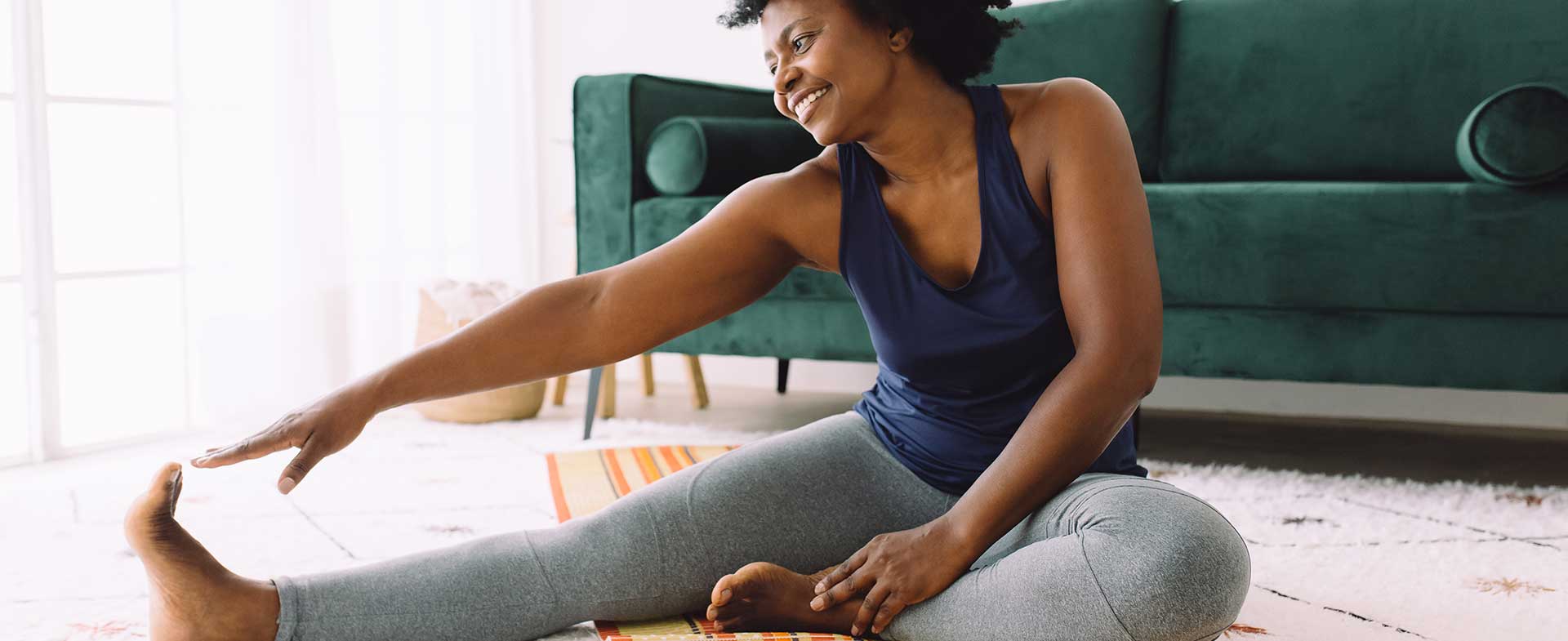 woman stretching at home