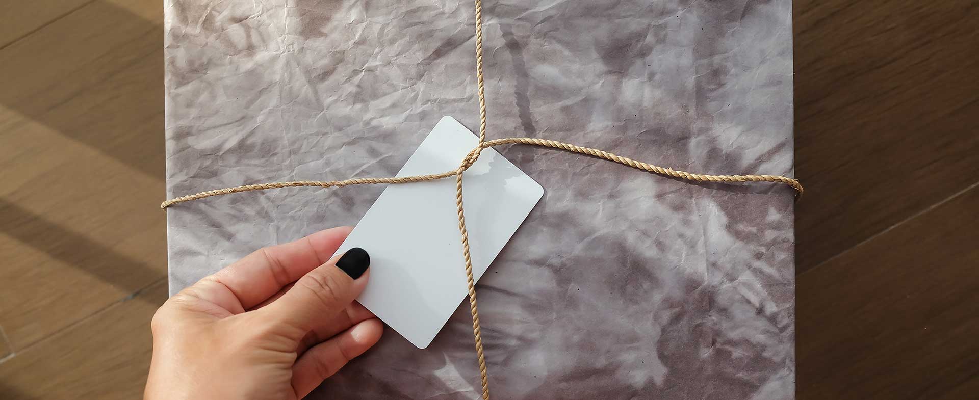 person wrapping gift