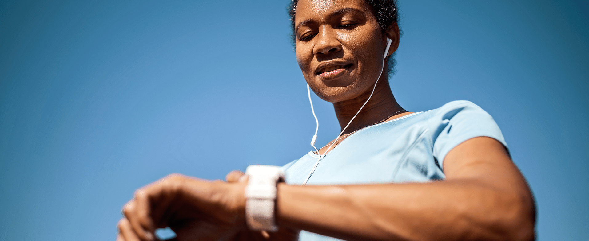 woman looking at smart watch