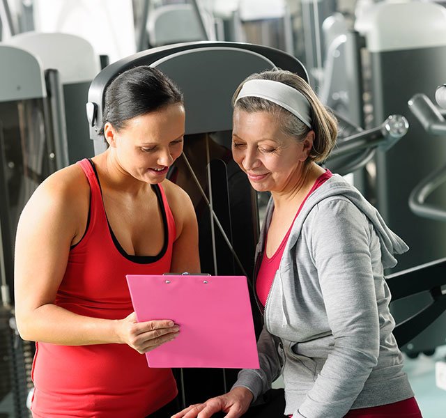 woman talking with trainer