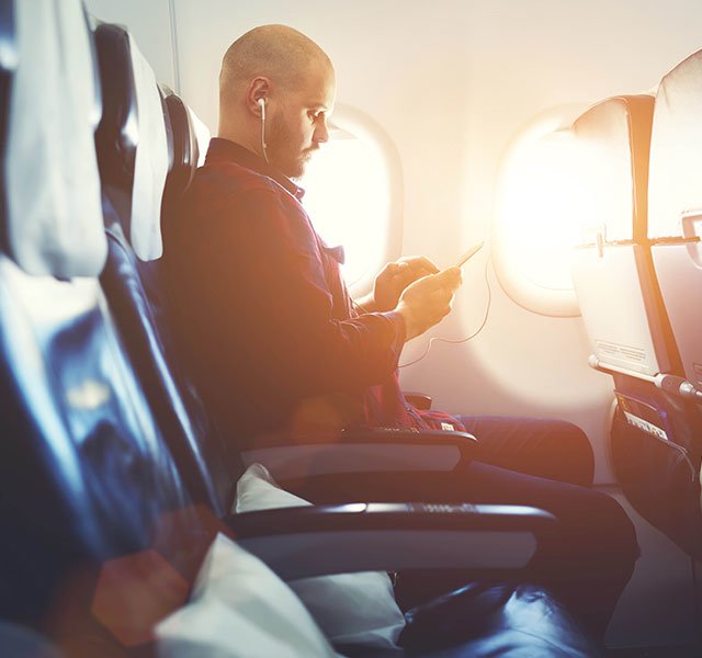 man sitting on a plane