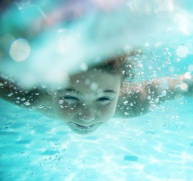 little kid underwater