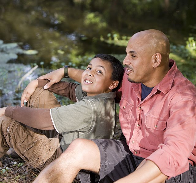 father and son by water