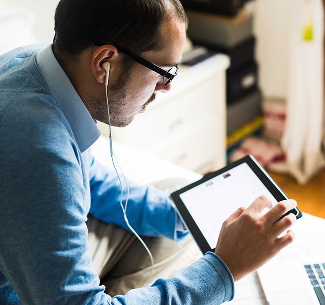 man with headphone and tablet