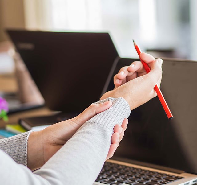 woman holding her wrist