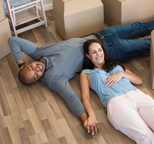 man and woman laying on the floor