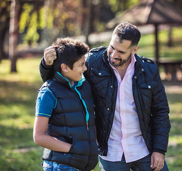 father and son in the park together