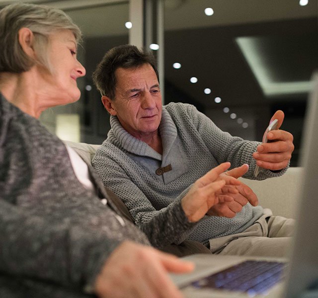 older couple looking at a computer