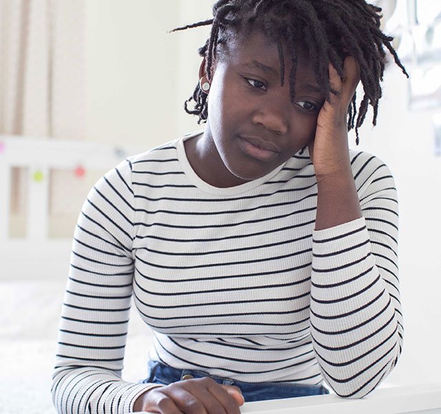 teenage girl looking worried