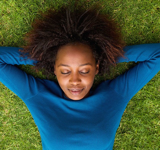 woman lying in the grass