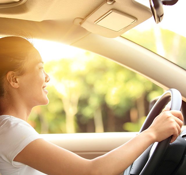 young woman driving a car