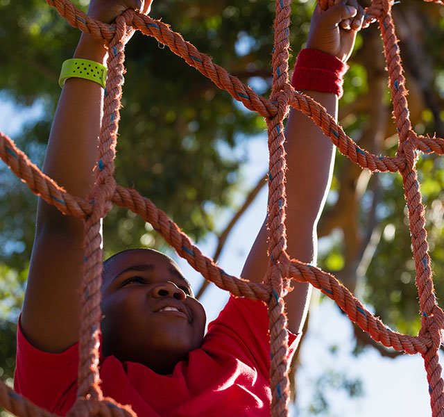 boy climbing rope