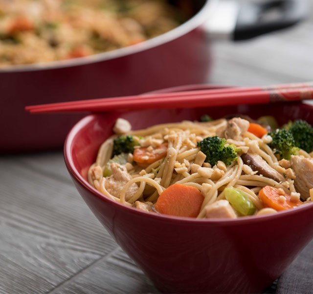chicken and peanut lo mein horizontal with pan