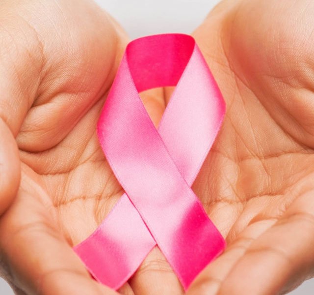 hands holding breast cancer ribbon