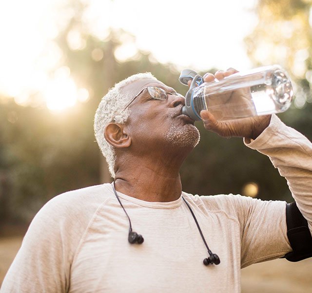 man drinking water in earlier morning