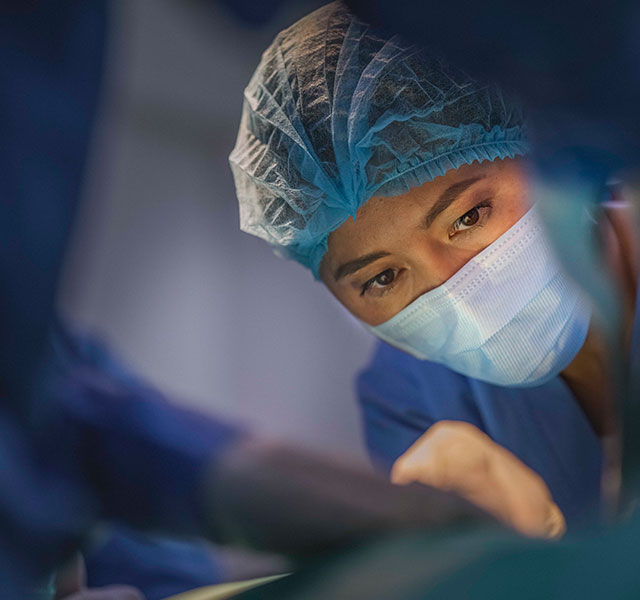 female surgeon with surgical mask