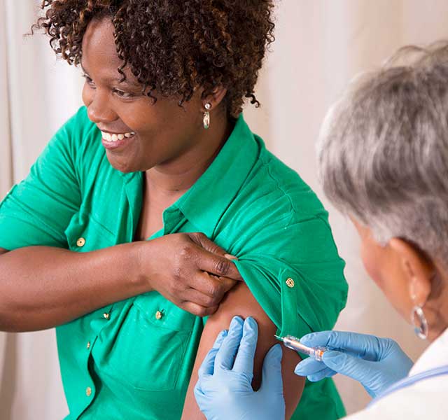 Mature woman getting a vaccine booster