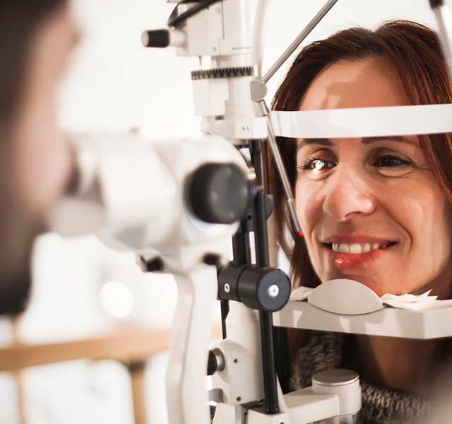 Woman over age 40 getting an annual eye exam 