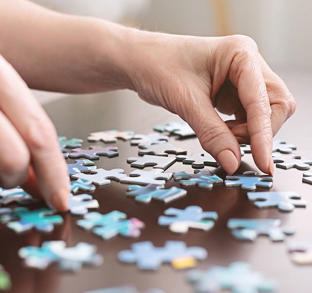 woman doing puzzle