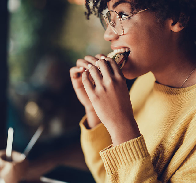 woman eating sandwich