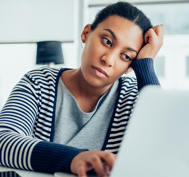 tired woman at computer