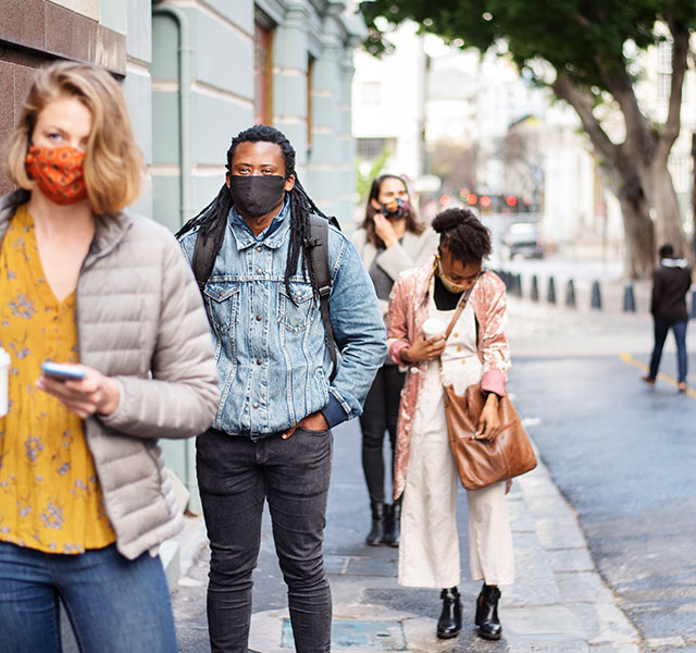 people in line wearing masks
