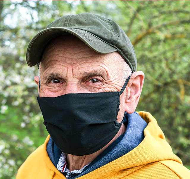 old person wearing mask