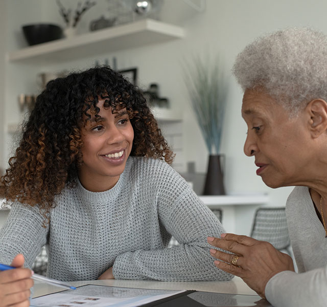 young woman talking with grandmother